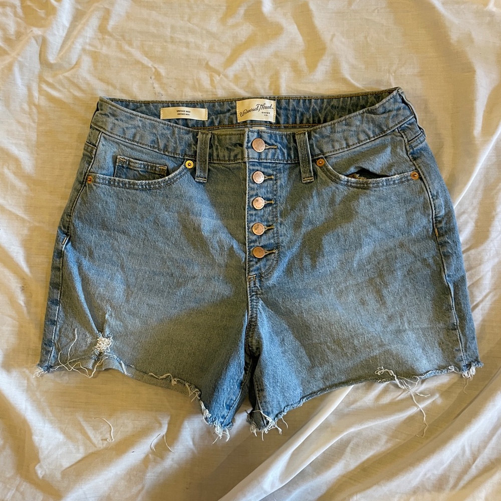 Universal Threads button fly high rise blue denim shorts. Size 6/28 distressed